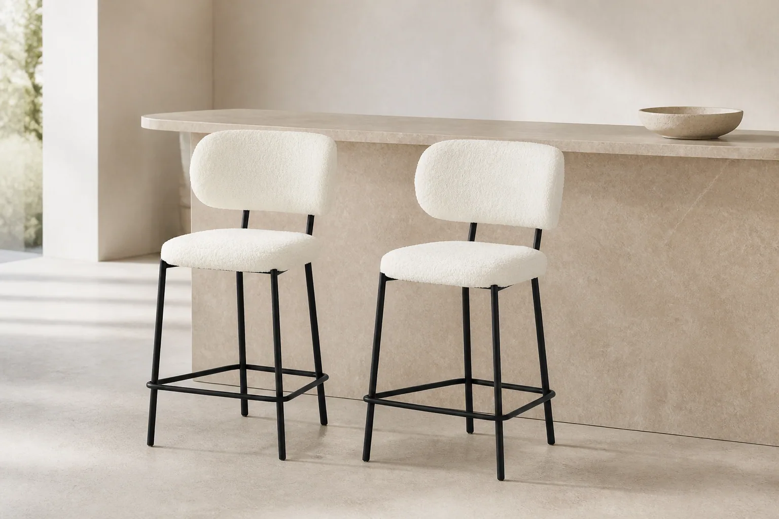 Two HTB0010 ivory textured bar stools with black frames beside a pale kitchen island